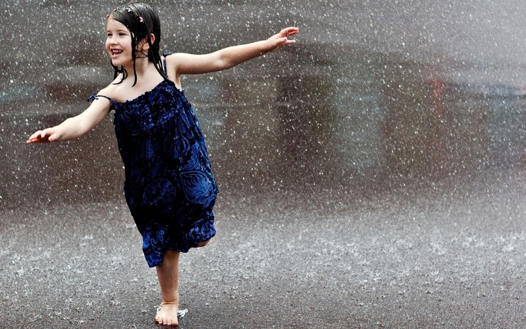 girl dancing in rain www.colburns.net